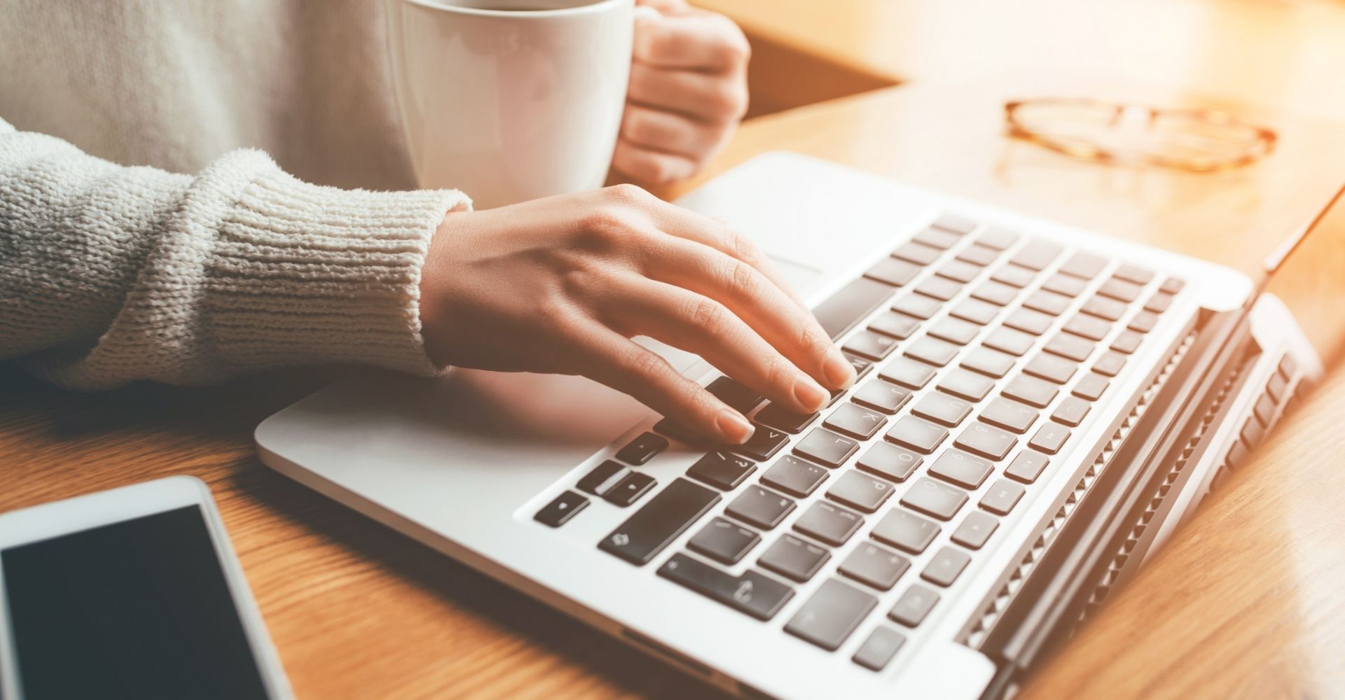 Woman typing at keyboard